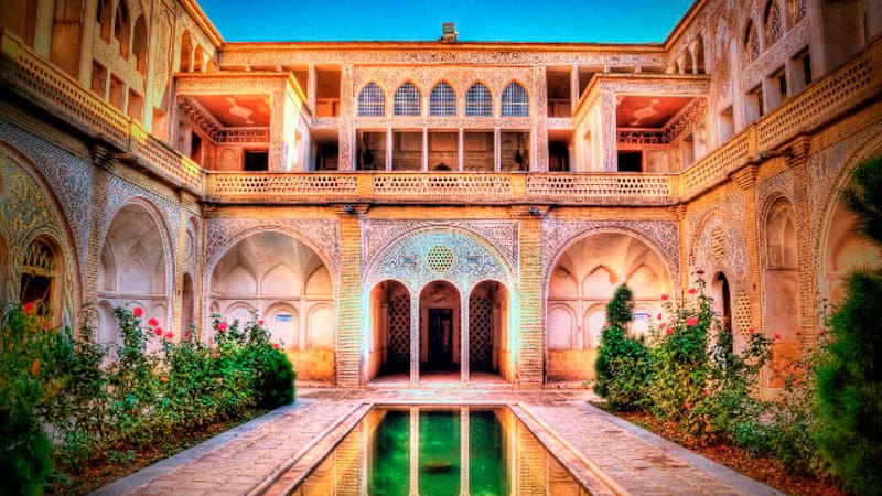 Abbasi House inTraditonal Location of Kashan City in day light with beautiful flowers